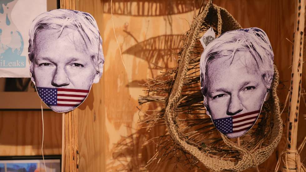 epa10568708 Cutouts of WikiLeaks founder Julian Assange during a protest to mark the fourth anniversary of his detention in Thamesmead South-East London Belmarsh prison, in Brussels, Belgium, 11 April 2023. Julian Assange is in his fourth year of imprisonment in Britain whilst the US government tries to extradite him to face charges of espionage.  EPA/OLIVIER MATTHYS