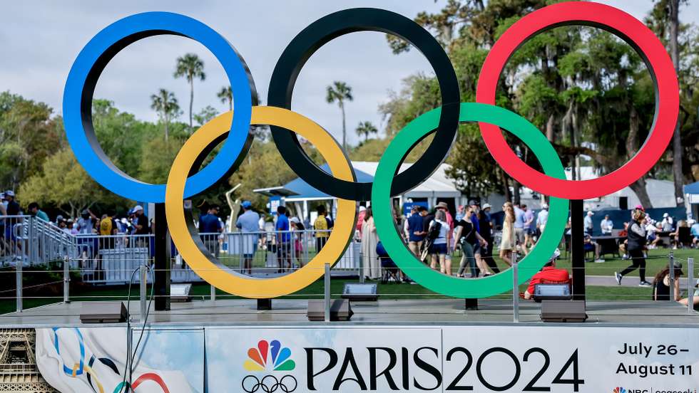 epa11224048 The Olympic Rings logo, promoting the Paris 2024 Summer Olympic Games, are on display in the fan experience area during the third round of The Players Championship golf tournament at TPC Sawgrass in Ponte Vedra Beach, Florida, USA, 16 March 2024.  EPA/ERIK S. LESSER