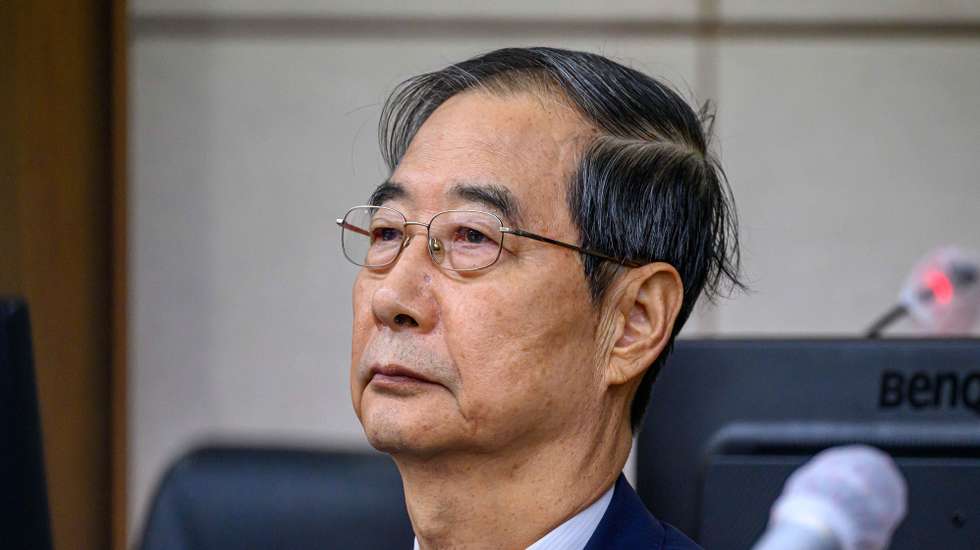 epa12415893 Former South Korean Prime Minister Han Duck-soo sits in a courtroom at the Seoul Central District Court in Seoul, South Korea, 30 September 2025. Duck-soo attended the first hearing of his trial over allegations that he aided former South Korean President Yoon Suk Yeol effort's to impose martial law on 03 December 2024.  EPA/YONHAP SOUTH KOREA OUT