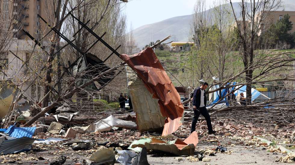 epa12868676 People walk amid the debris after US-Israeli airstrikes on the Shahid Beheshti University, in Tehran, Iran, 04 April 2026. A joint Israeli and US military operation, launched on 28 February, continues to target multiple locations across Iran.  EPA/ABEDIN TAHERKENAREH