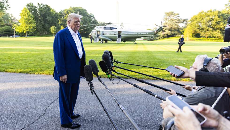epa12194389 US President Donald Trump speaks to the media as he departs the White House for the NATO leaders summit, in Washington, DC, USA, 24 June 2025. The president answered questions about accusations of ceasefire violations in the Iran-Israel conflict.  EPA/JIM LO SCALZO