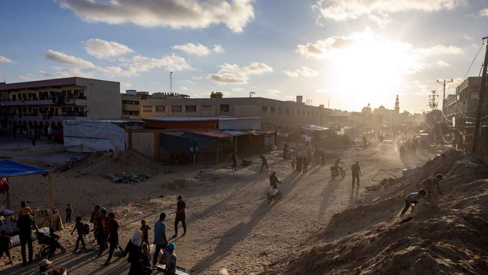 epa11342972 Palestinians walk in a street of the Khan Yunis camp in the southern Gaza Strip, 15 May 2024. More than 35,000 Palestinians and over 1,455 Israelis have been killed, according to the Palestinian Health Ministry and the Israel Defense Forces (IDF), since Hamas militants launched an attack against Israel from the Gaza Strip on 07 October 2023, and the Israeli operations in Gaza and the West Bank which followed it.  EPA/HAITHAM IMAD