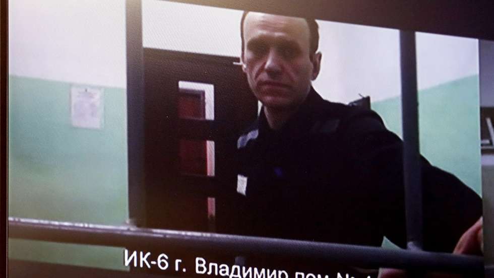 epa10884391 Russian opposition figure Alexei Navalny is seen on a screen as he appears in a video link from the colony in Vladimir region, during a hearing of The First Court of Appeal of General Jurisdiction considering his appeal against the sentence of 19 years in prison in a case of extremism, Moscow, Russia, 26 September 2023. Navalny has been in the colony since February 2021, when the court, at the request of the Federal Penitentiary Service, replaced his suspended sentence in the Yves Rocher case of 2014 with a real one. He was supposed to serve in a penal colony for 2 years and 8 months, but in March 2022, the Lefortovo Court of Moscow, at an off-site meeting in correctional colony in the city of Pokrov, Vladimir Region, sentenced the politician to 9 years of strict regime and a fine of 1.2 million rub., as well as one and a half years of restriction of freedom in the case of fraud and contempt of court. In June 2023 Navalny went on trial on new charges of extremism. The court sentenced politician Alexei Navalny to 19 years in a strict regime colony. The First Court of Appeal of General Jurisdiction rejected the politician's complaint.  EPA/MAXIM SHIPENKOV