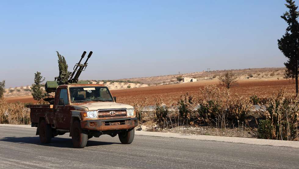 epa11754241 A Syrian opposition military vehicle drives on the Damascus-Aleppo International Highway in the province of Hama, Syria, 03 December 2024. Syrian opposition forces, led by the Islamist militant group Hayat Tahrir al-Sham (HTS), launched an offensive on 27 November, taking large parts of Aleppo, Syria's second-largest city. The offensive triggered counterattacks by the Syrian regime forces as well as Russian and Syrian airstrikes on opposition-controlled areas.  EPA/MOHAMMED AL RIFAI