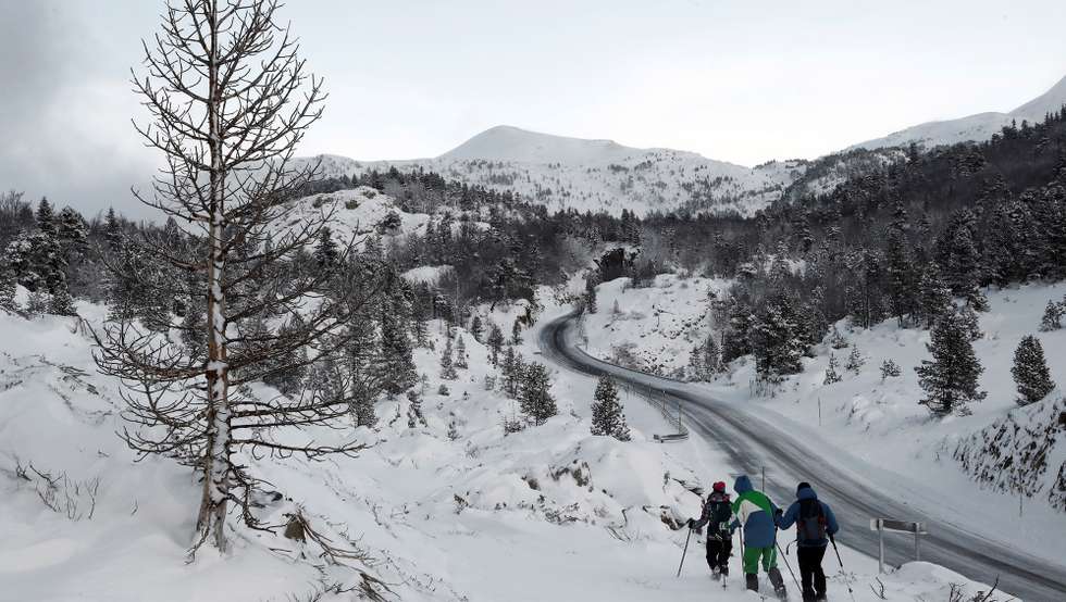 epa08140908 Several hikers go for a walk in the area of Larra-Belagoa, in Pyrenees mountain range, close to the village of Belaoga, northern Spain, 19 January 2020. Spanish Meteorologist Agency foresees heavy snowfalls in northern Spain.  EPA/Jesus Diges