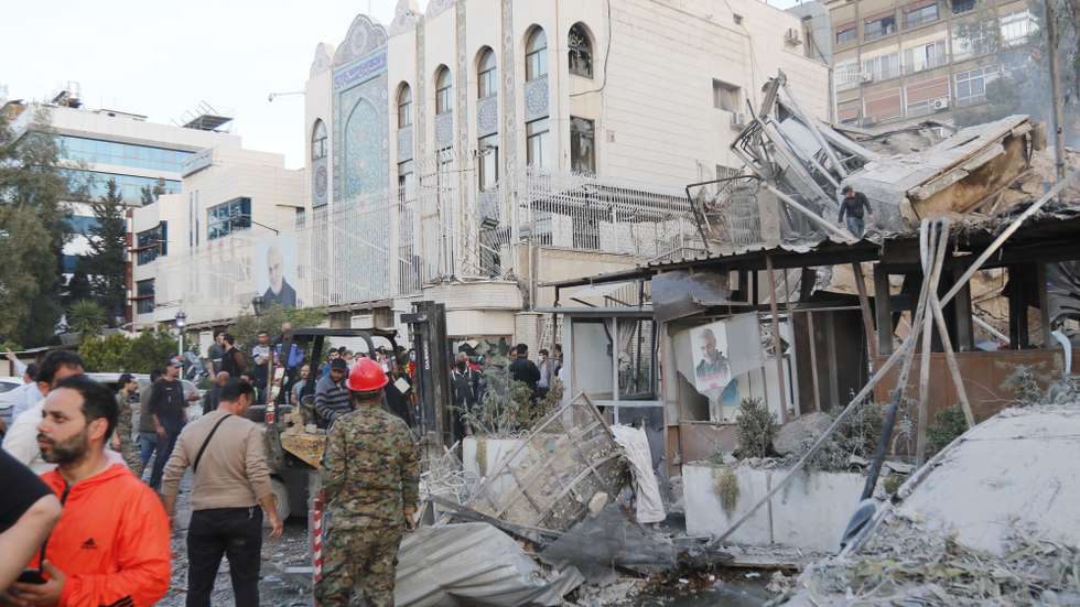 epa11254836 Destruction following an airstrike on a building next to the Iranian consulate in Damascus, Syria, 01 April 2024. According to the Syrian Arab News Agency SANA, Israel on 01 April launched an airstrike targeting the Iranian consulate building in Damascus. The consulate was damaged while the building next to it was destroyed.  EPA/YOUSSEF DAFAWWI