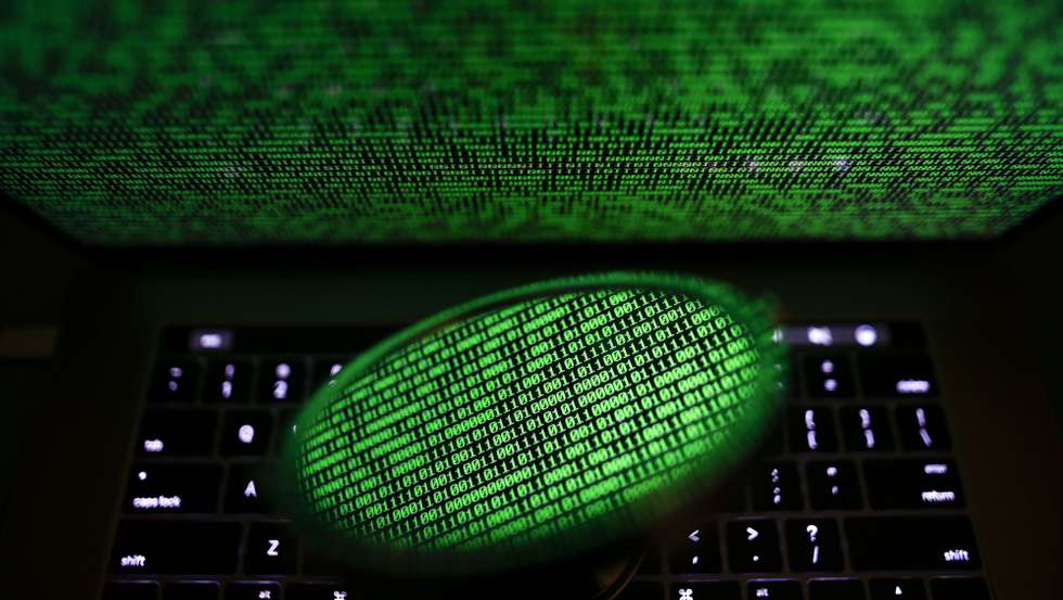 epa06053461 A mirror reflects a computer screen displaying binary code in Taipei, Taiwan, 28 June 2017. Kaspersky Lab reported that the malware, despite resembling 'Petya' malware that affected computers last year, is believed to be a new type of ransomware, which the cybersecurity company called 'ExPetr'. The ransomware has reportedly affected mostly Ukraine and Russia and several cases were also found in Poland, Italy, Britain, Germany, France, the US and several other countries, with around 2,000 cases reported so far. The ransomware has reportedly affected US pharmaceutical giant Merck, Russia's oil producer Rosneft, Ukrainian central bank, Spanish food company Mondelez, Australia's Cadbury chocolate factory and French shipping company TNT, among other global companies.  EPA/RITCHIE B. TONGO