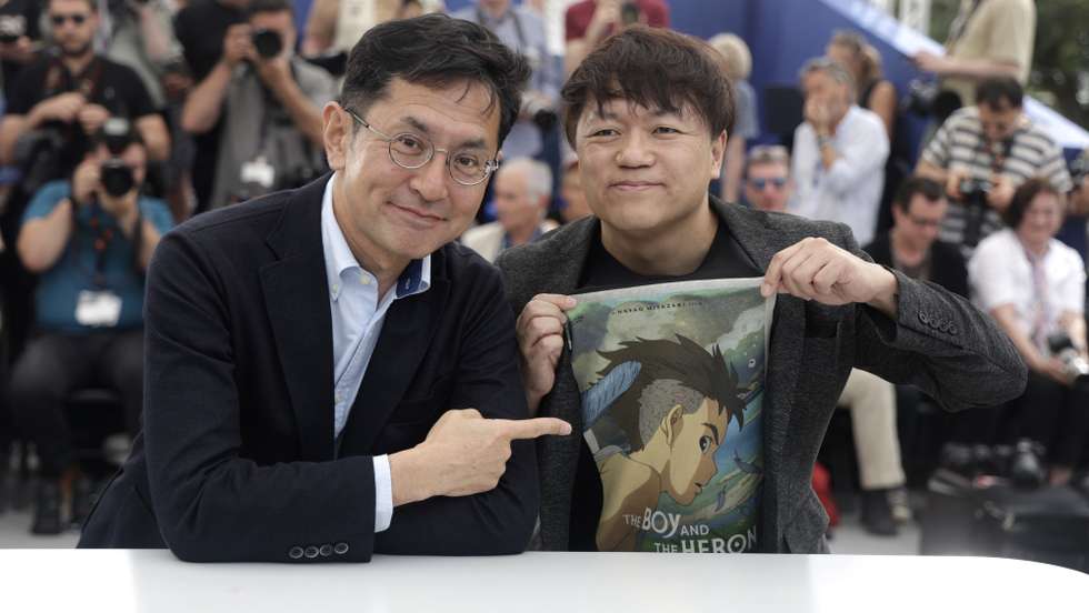 epa11354823 Japanese director Goro Miyazaki (L) and Kenichi Yoda of Studio Ghibli attend a 'Palme d'Or d'Honneur' photocall during the 77th annual Cannes Film Festival, in Cannes, France, 20 May 2024. Studio Ghibli will receive the 'Palme d'Or d'Honneur', the honorary Golden Palm Award at the film festival which runs from 14 to 25 May 2024.  EPA/GUILLAUME HORCAJUELO