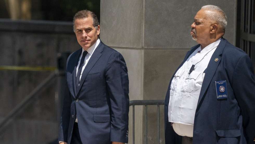 epa10770130 Hunter Biden (L) departs the US Federal District Court in Wilmington, Delaware, USA, 26 July 2023. Hunter Biden's hearing ended with him pleading not guilty after US District Judge Maryellen Noreika said she was not ready to accept the plea deal.  EPA/SHAWN THEW