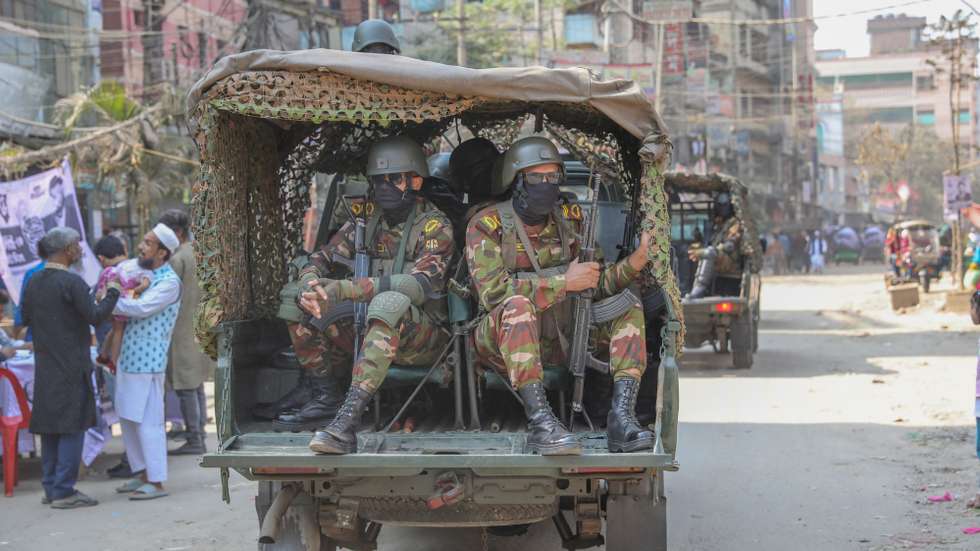 epa12731431 Members of the Bangladesh Army patrol during the 13th national general election in the Kanchpure area of Narayanganj, Bangladesh, 12 February 2026. Voters are choosing members of the national parliament and voting in a referendum on proposed July National Charter constitutional reforms.  EPA/MONIRUL ALAM