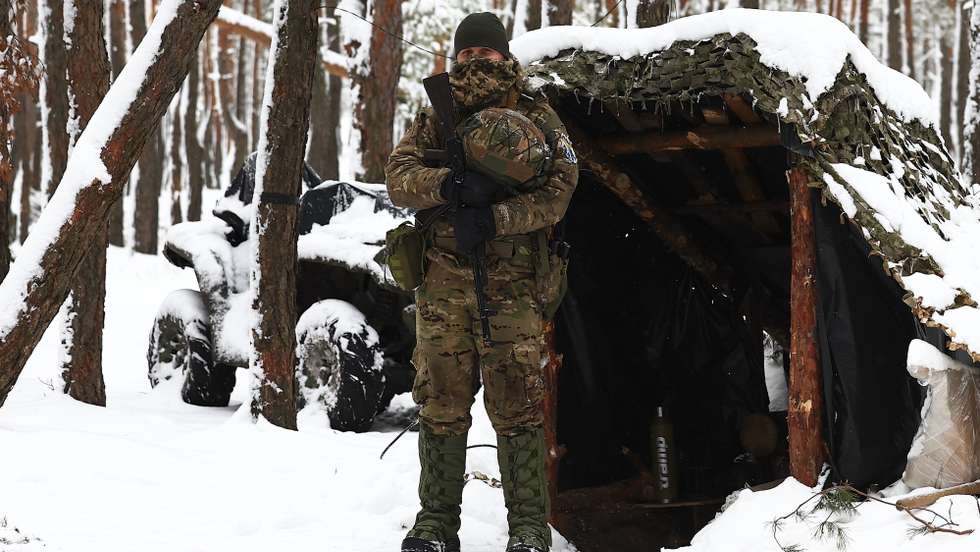 A soldier of Khartia brigade stands guard at a Ukrainian defence position in Kupiansk-Lyman, in the Donbass region, Ukraine, 10 February 2024.  Russian troops entered Ukrainian territory on 24 February 2022, starting a conflict that has provoked destruction and a humanitarian crisis.  ANTONIO COTRIM/LUSA