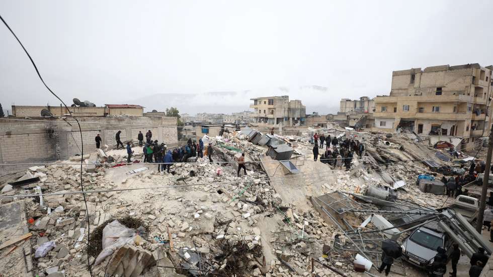 epa10450727 Rescuers work at the site of a collapsed building following an earthquake in Armanaz town, Idlib Governorate, Syria 06 February 2023. According to the US Geological Service, an earthquake with a preliminary magnitude of 7.8 struck southern Turkey close to the Syrian border, causing buildings to collapse and sending shockwaves over northwest Syria, Cyprus, and Lebanon. At least 221 people were killed and 419 injured in northwest Syria, with hundreds remaining trapped under the rubble, according to the White Helmets group, the Syria Civil Defence operating in the area.  EPA/YAHYA NEMAH