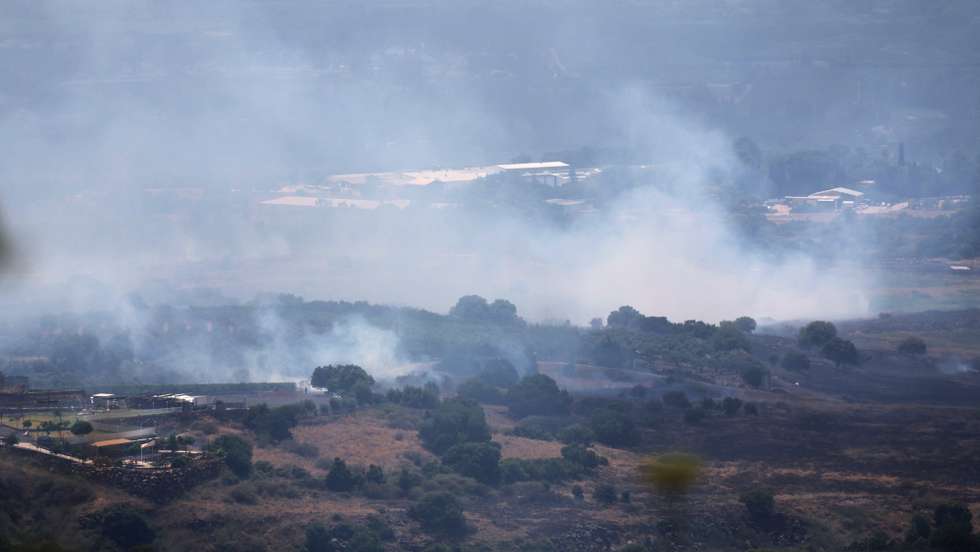 epa11399883 Smoke from a fire following strikes from Lebanon, near Banias, in the Israeli-annexed Golan Heights, 09 June 2024. The Israeli military stated on 09 June, that 'hostile aircraft' entered northern Israel, two unmanned aerial vehicles (UAVs) were identified crossing from Lebanon. The aircraft fell in the northern Golan Heights area and no injuries were reported, the statement added. As a result of the UAV attacks, fires were ignited in the area and Israeli firefighters responded to the scene to extinguish the fires.  EPA/ATEF SAFADI