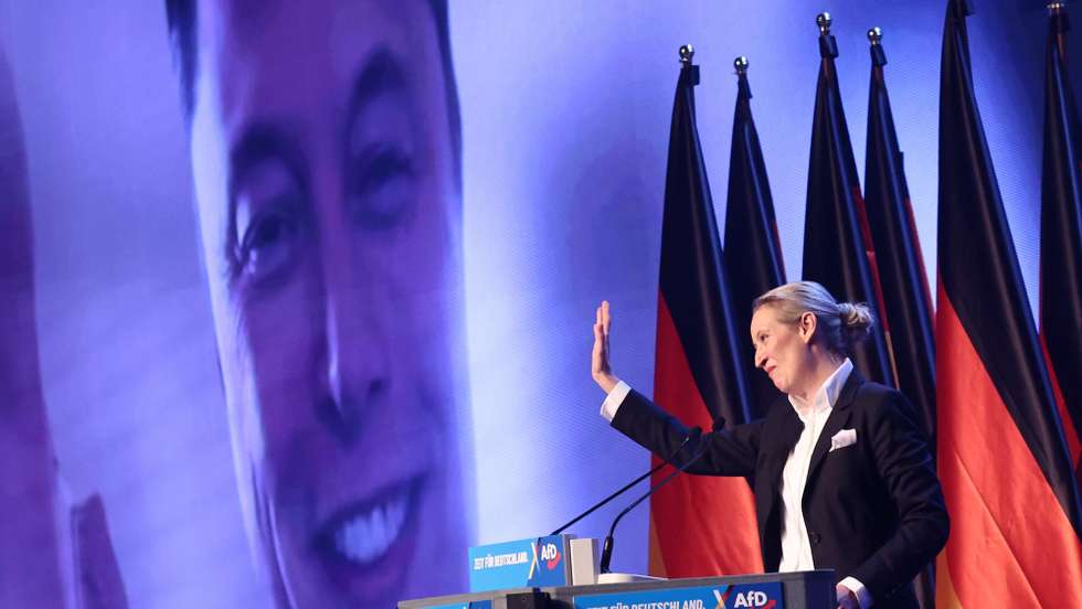epa11852370 Alternative for Germany (AfD) party and faction co-chairwoman and top candidate for the federal election Alice Weidel talks online to Elon Musk during her speech during election campaign launch in Halle, Germany, 25 January 2025. Germany will hold early federal elections on 23 February 2025.  EPA/HANNIBAL HANSCHKE