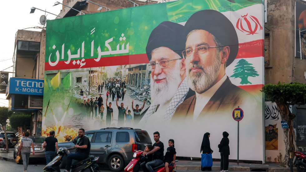epa13047619 A billboard features portraits of Iran's new Supreme Leader Ayatollah Mojtaba Khamenei (R) and his father, the late Supreme Leader Ayatollah Ali Khamenei (L), with a statement 'Thank you Iran' during Muharram in the southern suburbs of Beirut, Lebanon, 18 June 2026. Shiite Muslims across the world are observing the holy month of Muharram, the first month of the Islamic calendar, which culminates with the celebration of the Ashura festival, commemorating the martyrdom of Imam Hussein, a grandson of the Prophet Muhammad, in the Iraqi city of Karbala in the seventh century.  EPA/WAEL HAMZEH