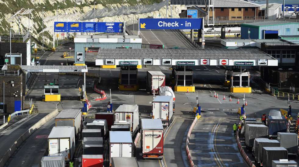 epa08902446 Freight trucks and other vehicles make their way through the Port of Dover in Dover, Britain, 24 December 2020. Dover Port has reopened its border after France closed its border with Britain for 48 hours over concerns about the new coronavirus variant. Lorry drivers must now obtain negative coronavirus tests before they will be allowed to cross by sea and the Port of Dover remains closed to outbound traffic on the morning of 23 December 2020.  EPA/ANDY RAIN