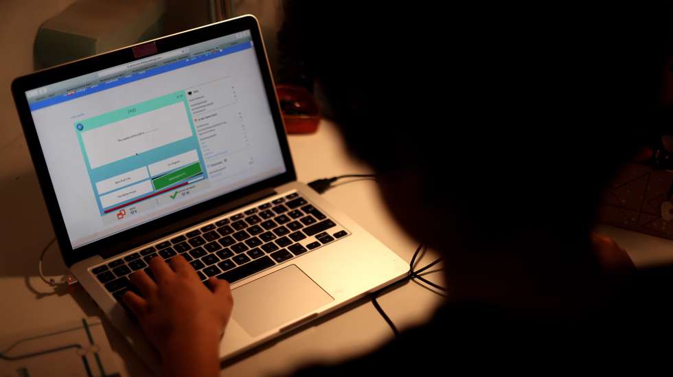 epa08308126 A boy in secondary school does his homework, which he has received by e-mail from his English teacher, in his house in Dortmund, Germany, 19 March 2020. Several European countries have closed borders, schools as well as public facilities, and have cancelled most major sports and entertainment events in order to prevent the spread of the SARS-CoV-2 coronavirus causing the Covid-19 disease.  EPA/FRIEDEMANN VOGEL
