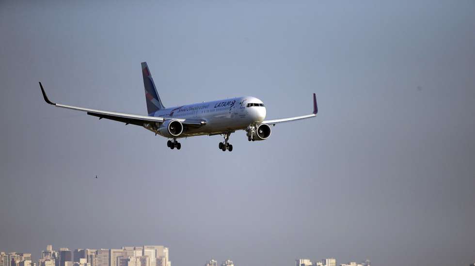 epa08444138 (FILE) - A LATAM Airlines Group plane carrying the Olympic flame arrives at the airport of Brasilia, Brazil, 03 May 2016 (reissued 26 May 2020). LATAM Airlines Group SA said on 26 May that the company filed for Chapter 11 bankruptcy protection in the United States following the devastating impact that the coronavirus pandemic had on air travel worldwide.  EPA/FERNANDO BIZERRA