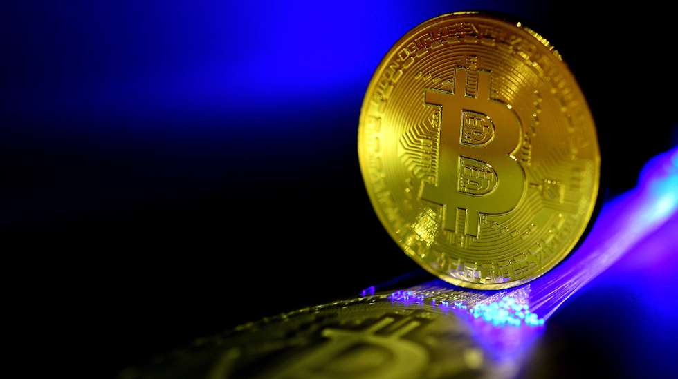 epa06407080 A Bitcoin is pictured in Duesseldorf, Germany, 27 December 2017. Wild swings in the price of bitcoin took a pause, after it temporarily dropped to 10,800 US dollar. The cryptocurrency's value plummeted by nearly a third last week, and was dealt another potential blow when the Israeli Securities Agency said it would bar companies trading in bitcoin from operating on the Tel Aviv stock exchange and investigate how to regulate the digital currency because of concerns about volatile prices.  EPA/SASCHA STEINBACH