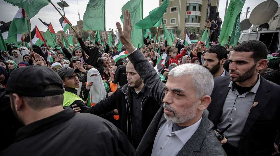 epa09065848 (FILE) - Hamas Gaza leader Yahya Al Sinwar (C) waves to supporters during a Hamas rally to mark the 31st anniversary of the group, in Gaza City, Gaza Strip, 16 December 2018 (reissued 10 March 2021). Sinwar was re-elected as Gaza Hamas leader on 10 March 2021.  EPA/MOHAMMED SABER *** Local Caption *** 54846862