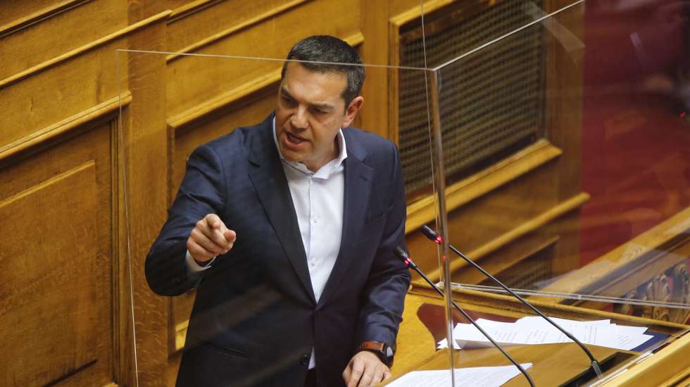 epa09718672 Greek main opposition SYRIZA - Progressive Alliance leader Alexis Tsipras delivers a speech during a debate on a motion of censure against the government at the Greek Parliament, in Athens, Greece, 30 January 2022. The censure motion was introduced by Tsipras, who said that a series of crises like the pandemic, price hikes, and snowstorm management 'prove that Prime Minister Kyriakos Mitsotakis and his government are ineffective and dangerous for the country.'  EPA/ALEXANDROS VLACHOS