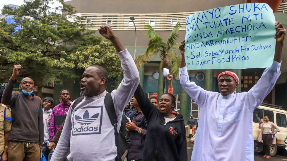 epa10732845 Protesters chant slogans and display signs during a rally against tax increases in Nairobi, Kenya, 07 July 2023. Protesters came out in force in many cities around Kenya to demonstrate against a raft of controversial tax increases signed into law by Kenyan President Ruto last week.  EPA/STRINGER