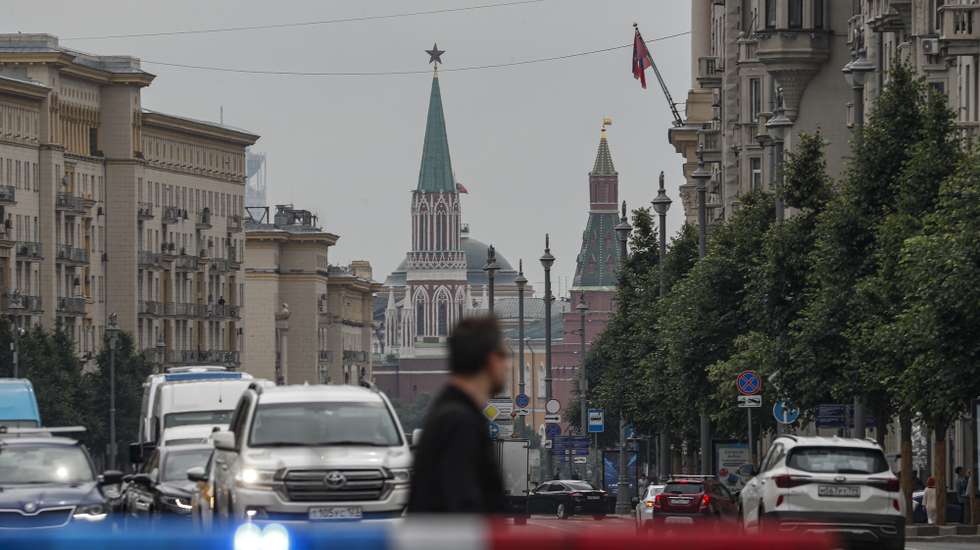 epa10718889 A man crosses a street in front of the Moscow Kremlin, in downtown Moscow, Russia, 30 June 2023. On 24 June, counter-terrorism measures were enforced in Moscow and other Russian regions after (PMC) Wagner Group Chief Prigozhin claimed that his troops had occupied the building of the headquarters of the Southern Military District in Rostov-on-Don, demanding a meeting with Russia's defense chiefs. Belarusian President Lukashenko, a close ally of Putin, negotiated a deal with Wagner chief Prigozhin to stop the movement of the group's fighters across Russia. Prigozhin, after announcing Wagner fighters' halt of their march on Moscow and retreat to their field camps, left Russia for Belarus.  EPA/MAXIM SHIPENKOV