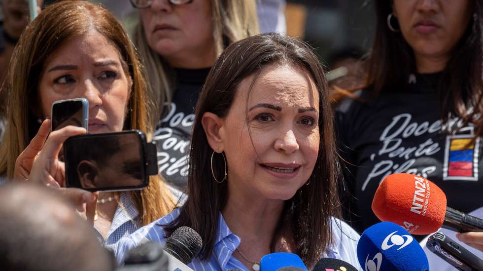 epa10789666 Venezuelan opposition leader Maria Corina Machado makes a statement in Caracas, Venezuela, 07 August 2023. Machado denounced 'a political persecution' by the Venezuelan Armed Forces against presidential canditates who are campaigning.  EPA/RAYNER PENA R
