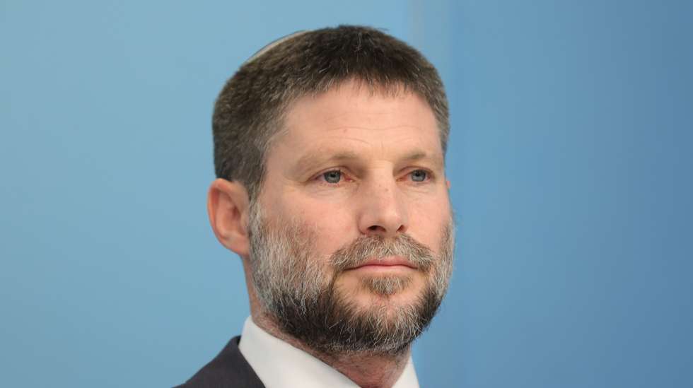 epa10400419 Israel's Finance Minister Bezalel Smotrich holds a press conference with Prime Minister Benjamin Netanyahu (not pictured) at the prime minister's office in Jerusalem, Israel, 11 January 2023.  EPA/ABIR SULTAN