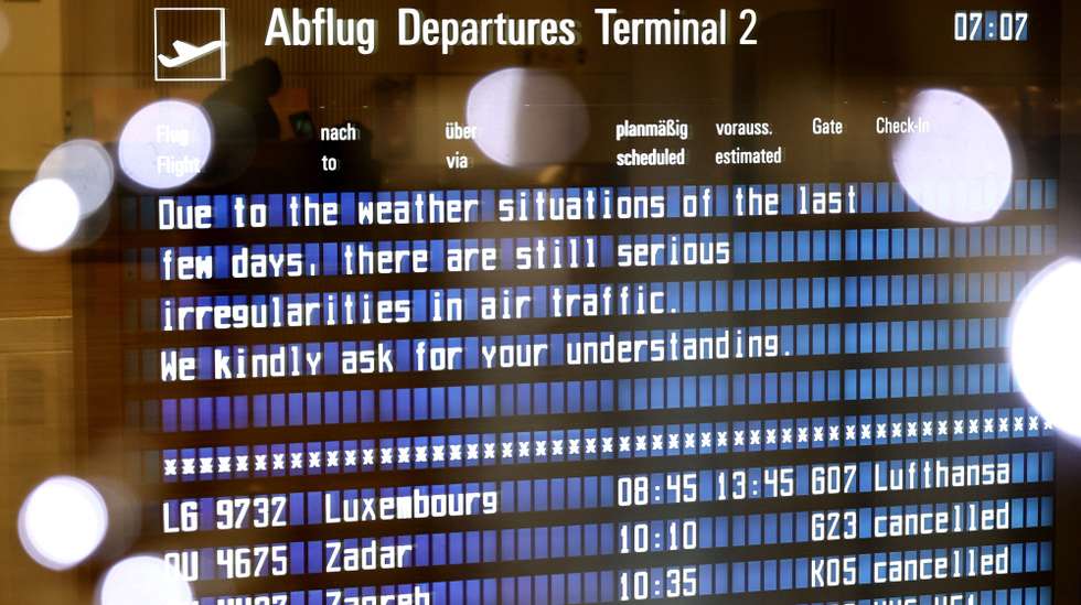 epaselect epa11011413 A board announces irregularities in air traffic due to winter weather conditions in Munich, Germany, 05 December 2023. Munich Airport's spokesman announced on the evening of 04 December that there would be no take-offs and landings on 05 December from the start of operations at 6 a.m. to 12 p.m, due to the freezing rain forecast. Flight operations at Munich Airport have been temporarily suspended over the weekend due to heavy snowfall.  EPA/ANNA SZILAGYI