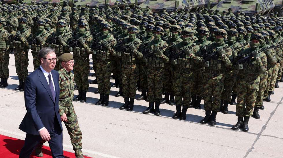 epa10585790 Serbian President Aleksandar Vucic (L) and Army Chief of Staff Milan Mojsilovic (2-L) inspect the troops during the Serbian Armed Forces capabilities demonstration 'Granit 2023' at the Batajnica military airport near Belgrade, Serbia, 22 April 2023. The capabilities presentation was arranged on the occasion of the Serbian Armed Forces Day, that is annually marked on 23 April. It marks the begin of the Second Serbian Uprising in 1815 which is regarded 'a milestone in the creation of the modern Serbian state and military'.  EPA/ANDREJ CUKIC