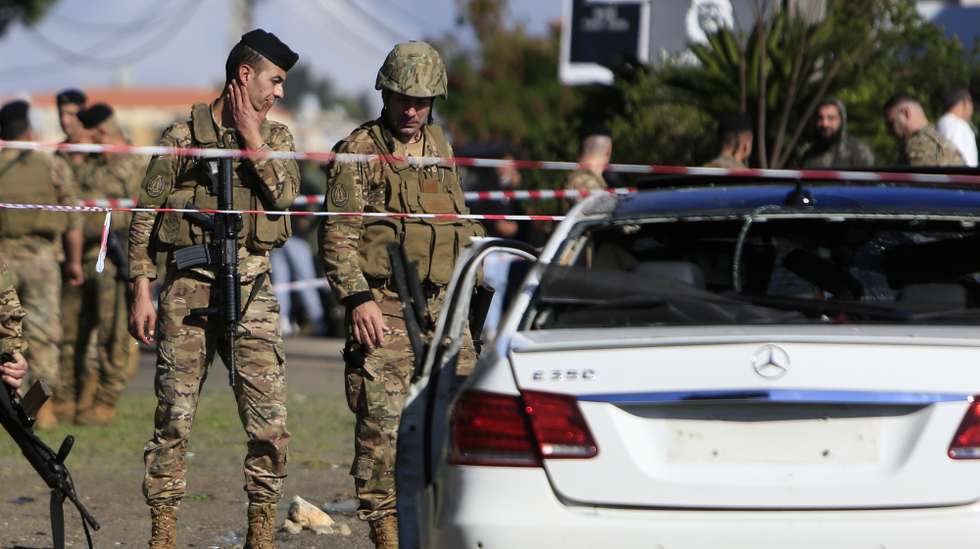 epaselect epa11142311 Lebanese army soldiers stand around a  wrecked car following a drone strike in the village of Jadra, between Beirut and Sidon, Lebanon, 10 February 2024. Lebanese state media said at least two people were killed in an Israeli drone strike on a car in the town of Jadra, in the Chouf district. Hamas said a senior member survived the attack, and the Israeli army did not comment on the incident.  EPA/STR