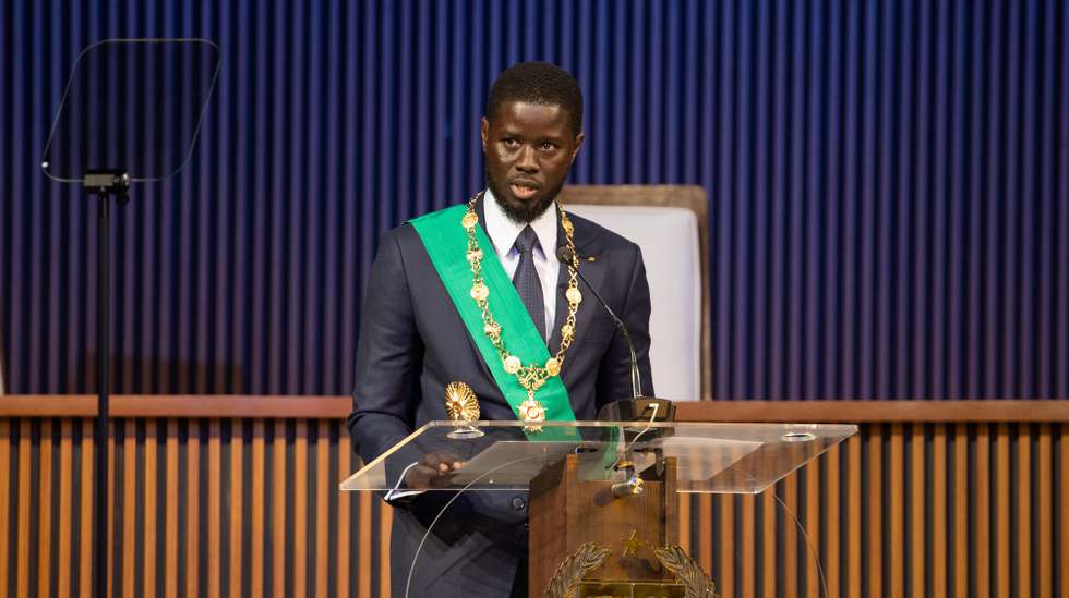 epa11255375 Newly sworn in Senegalese President Bassirou Diomaye Faye speaks during his inauguration ceremony at the Abdou Diouf International Convention Centre in Diamniadio, Senegal, 02 April 2024. Faye, freed from jail on 14 March, won the election on the first round claiming 54,28 percent of the votes.  EPA/JEROME FAVRE