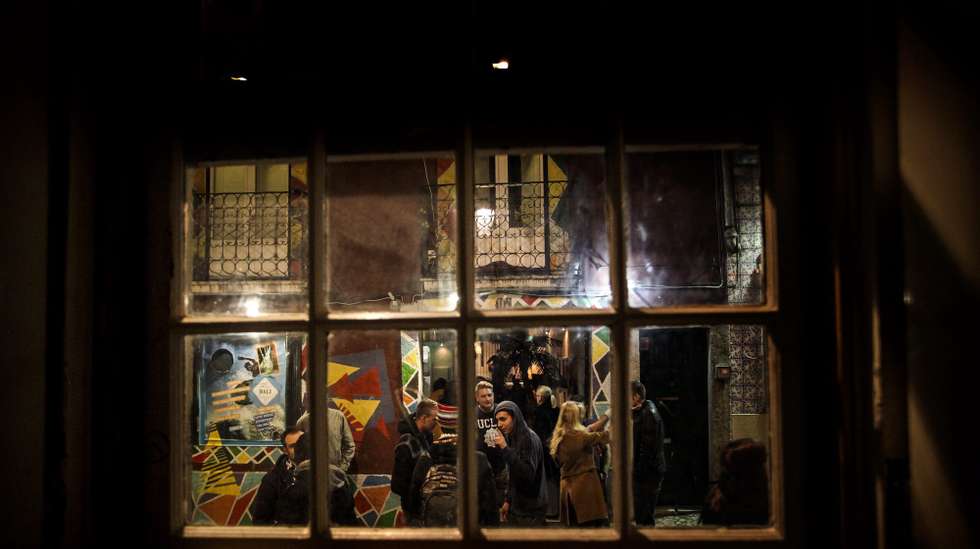 epa03985972 (24/24) People talk outside a bar in the Bairro Alto district of Lisbon, Portugal, 28 November 2013. Located in the heart of Lisbon, Bairro Alto celebrates 500 years on 15 December 2013.  EPA/MARIO CRUZ PLEASE REFER TO ADVISORY NOTICE  (03985948) FOR FULL FEATURE TEXT