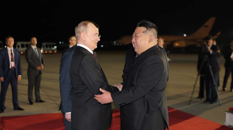 epa11421416 A photo released by the official North Korean Central News Agency (KCNA) shows Russian President Vladimir Putin (L) received by North Korean leader Kim Jong Un upon arrival at the airport of Pyongyang, North Korea, 18 June 2024 (issued 19 June 2024). The Russian president is on a state visit to North Korea from 18-19 June at the invitation of the North Korean leader. He last visited North Korea in 2000, shortly after his first inauguration as president.  EPA/KCNA   EDITORIAL USE ONLY  EDITORIAL USE ONLY