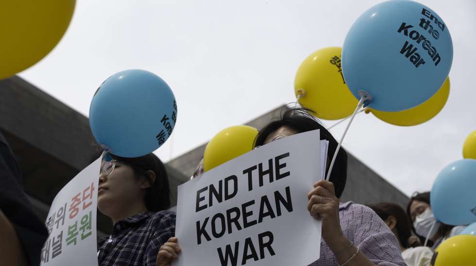 epa11435744 Members of the Kora Peace Action, hold up signs reading "No War, Yes Peace" during a rally against policy toward North Korea while South Korea marks the 74th anniversary of the Korean War in Seoul, South Korea, 25 June 2024. Protesters gathered to demand the restoration of the inter-Korean military agreement and inter-Korean dialogue channels and improved relations.  EPA/JEON HEON-KYUN