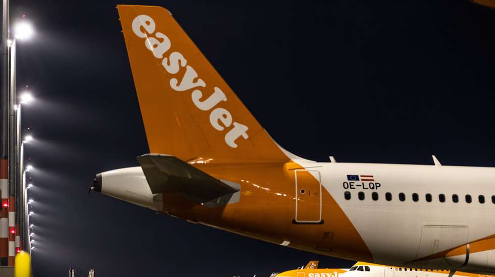 epa08790164 EasyJet airplanes stand at the terminal one during airport apron tour on the occasion of the first arrival at BER Berlin Brandenburg Airport in Schoenefeld, Germany, 31 October 2020. Berlin's new airport finally opened after nine years of delay.  EPA/HAYOUNG JEON