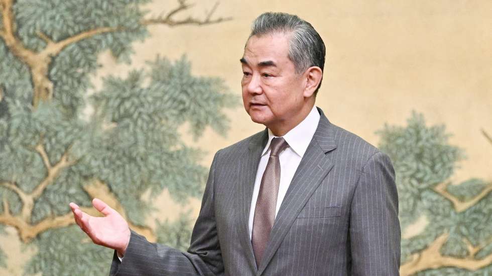 epa11492198 China's Foreign Minister Wang Yi gestures during an event hosting the vice chairman of the Central Committee of Palestinian organization and political party Fatah and the senior member of the Palestinian Islamist movement Hamas, at the Diaoyutai State Guesthouse in Beijing, China, 23 July 2024. China's Foreign Minister Wang Yi on 23 July hailed an agreement by 14 Palestinian groups to set up an 'interim national reconciliation government' to govern Gaza when the ongoing conflict is over. Palestinian groups including Hamas and Fatah met in Beijing this week in a renewed bid for reconciliation.  EPA/PEDRO PARDO / POOL