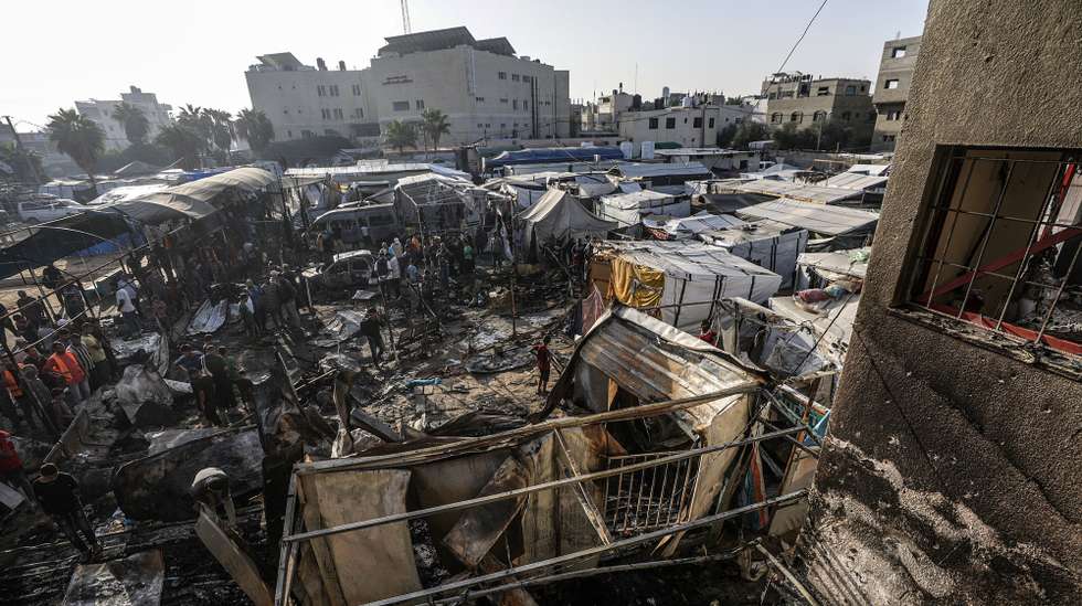 epa11657923 Palestinians inspect destroyed makeshift tents at a camp for internally displaced people on the premises of al-Aqsa Hospital, after the area was hit by an Israeli air strike, in Deir al Balah, central Gaza Strip, 14 October 2024. According to the Palestinian Ministry of Health, four people were killed as a result of the strike on al-Asqa hospital, and several dozens were wounded. More than 42,200 Palestinians and over 1,400 Israelis have been killed, according to the Palestinian Health Ministry and the Israel Defense Forces (IDF), since Hamas militants launched an attack against Israel from the Gaza Strip on 07 October 2023, and the Israeli operations in Gaza and the West Bank which followed it.  EPA/MOHAMMED SABER