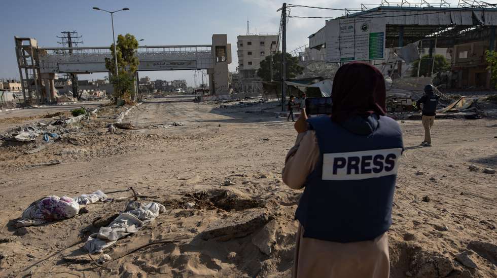 epa11641478 Photojournalist Doaa al Baz works on the streets in Gaza, 17 September 2024. Photojournalist Doaa al Baz, 30, is also currently settled in Khan Younis with a group of female colleagues, after leaving her home in the Nuseirat refugee camp in central Gaza.
She decided to leave and initiated the process to move out to Egypt through the Rafah border. “I stayed because of bad luck, the crossing was closed.”
“After the deliberate killing of journalists in the Gaza Strip - more than 175 were killed in Gaza -, as a woman I no longer feel safe. There is fear, tension, terror. Even this outfit that we wear, the press vest, no longer provides protection for the journalists working in the field,” she says.
“Simply because we are journalists in Gaza, it’s become much easier to kill us”.  EPA/HAITHAM IMAD  ATTENTION: For the full FOCUS ESSAY text please go to: https://epaimages.com/misc.pp?code=section-focus