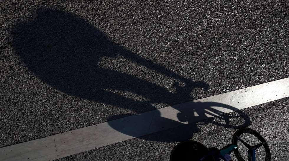 epa08722704 Shadow of Portuguese rider Gustavo Veloso of the W52 - FC Porto team during  the eighth stage of the Portugal Cycling Tour - Special Edition over a time trial of 17,7 km, in Lisbon, Portugal, 05 October 2020.  EPA/NUNO VEIGA