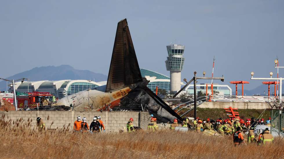 epa11796608 Firefighters carry out rescue operations at Muan International Airport in Muan, 288 kilometers southwest of Seoul, South Korea, 29 December 2024, after a passenger plane with 181 people aboard crashed. According to Yonhap New Agency, at least 28 people died after the Jeju Air passenger plane crashed during landing. The flight was inbound from Bangkok, Thailand.  EPA/YONHAP SOUTH KOREA OUT