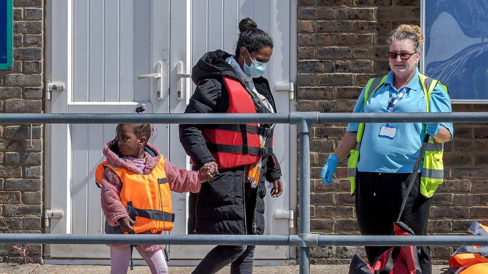 epa10105791 Migrants after disembarking a Border Force vessel which escorted 70 migrants after they were picked up in the English Channel, Dover, Britain, 04 August 2022. A report from the United Nations High Commissioner for Refugees and the British Red Cross has found that critical gaps in the UK asylum system may result in people being at risk of potential exploitation when they arrive in the UK.  EPA/Stuart Brock