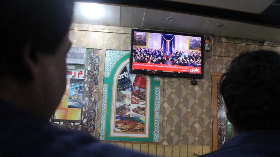 epa11840280 Afghans watch on a TV the inauguration ceremony of US President-elect Donald Trump in Kandahar, Afghanistan, 20 January 2025. Trump is sworn in for a second term as president of the United States in Washington, DC, on 20 January.Â   EPA/QUDRATULLAH RAZWAN