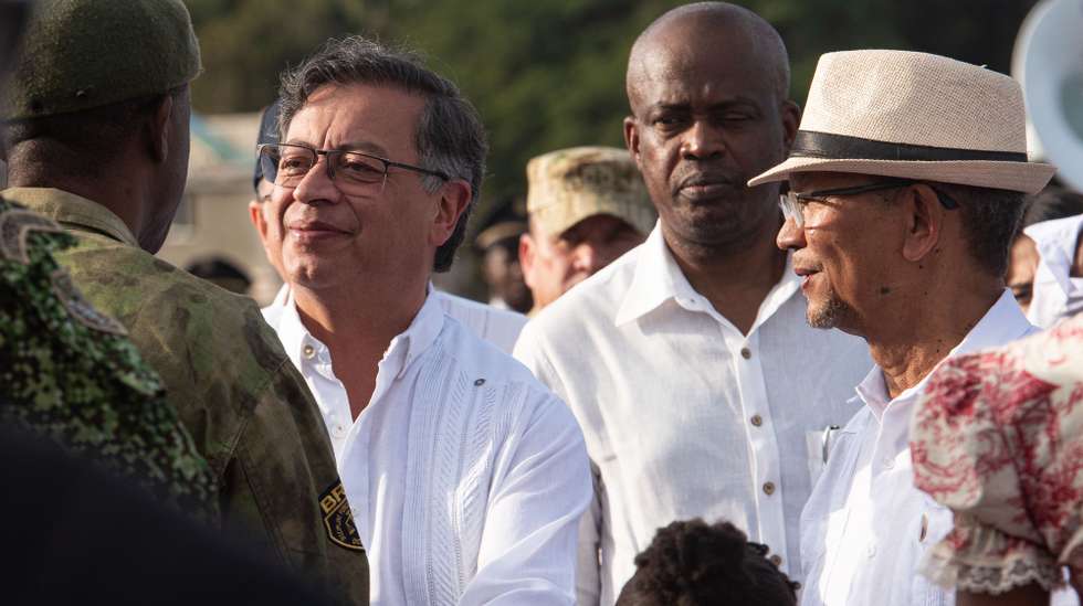 epa11846053 The president of Colombia, Gustavo Petro (L), greets authorities alongside the president of the Transition Council (CPT) of Haiti, Leslie Voltaire (R), upon his arrival at Jacmel Airport in Jacmel, Haiti, 22 January 2025. Petro arrived in Jacmel for a brief visit to strengthen bilateral relations and cooperation.  EPA/JOHNSON SABIN