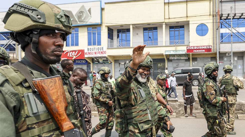 epa11868072 Leader of Alliance Fleuve Congo (AFC) Corneille Nangaa (C) waves as he arrives to participate in a cleanup exercise of the city of Goma, Democratic Republic of the Congo, 01 February 2025. The M23 (March 23 Movement) rebel group called for all residents to participate in a cleaning exercise of Goma city, the capital of the North Kivu Province, days after claiming to have captured most of it after launching a large-scale offensive in the east of the DR Congo, which the DR Congo and the UN accuse Rwanda of backing.  EPA/DANIEL IRUNGU