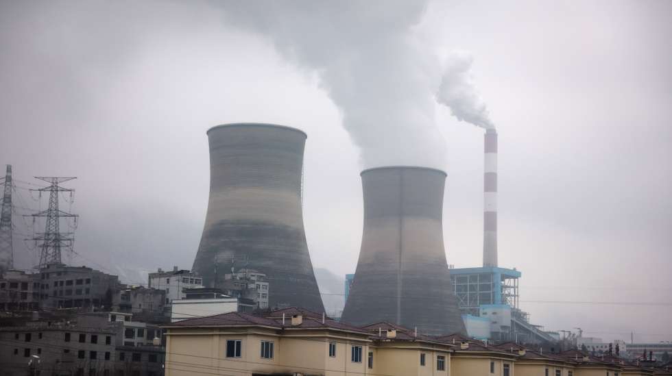 epa11097908 A coal power plant along the mountains in Tangfang Town of Zhenxiong County, Yunnan province southwest of China, 23 January 2024. Chinese state media reported at least 20 dead and 24 missing after a landslide hit Liangshui Village in China's southwest province of Yunnan early morning on 22 January, with 18 homes buried and more than 500 people evacuated.  EPA/MARK R. CRISTINO