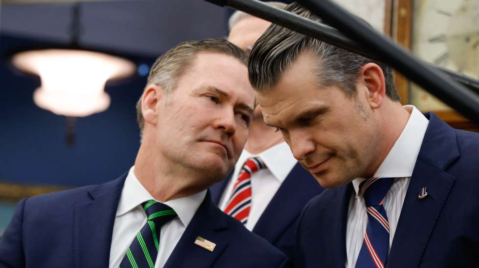 epa11922263 (L-R) US National Security Advisor Mike Waltz speaks with Defense Secretary Pete Hegseth as US President Donald Trump meets with French President Emmanuel Macron in the Oval Office of the White House in Washington, DC, USA, 24 February 2025.  EPA/LUDOVIC MARIN / POOL