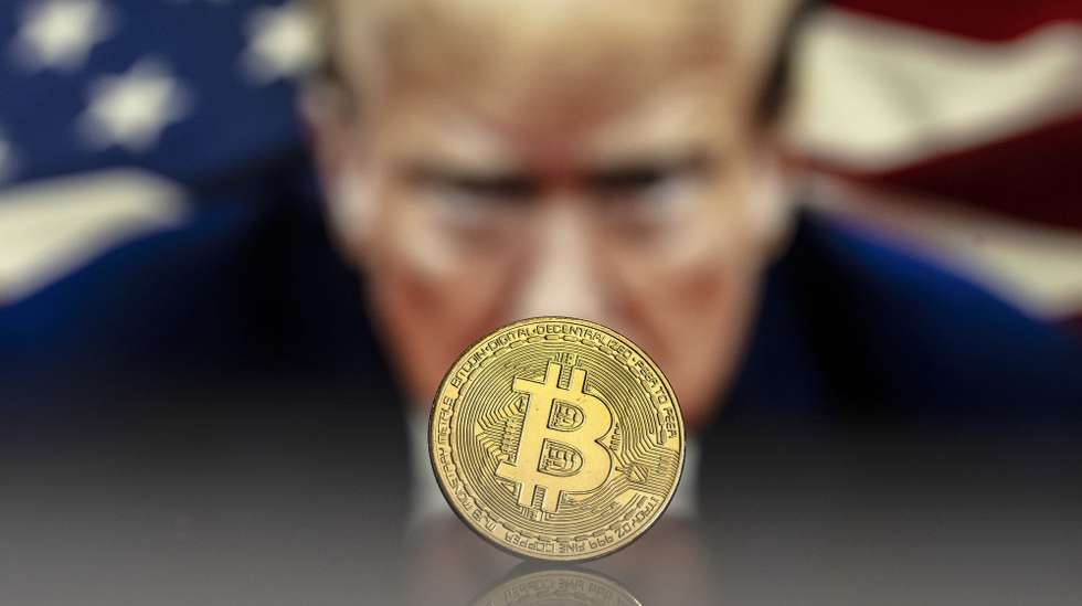 epa11780123 (FILE) - An illustration shows a Bitcoin mockup in front of an image of US President-elect Donald Trump, 22 November 2024 (reissued 16 December 2024). The world's most popular cryptocurrency hit a new record high on 16 December 2024, briefly passing 106,000 dollars (100,800 euros).  EPA/PABLO GIANINAZZI