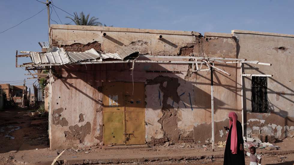epa11700440 A woman and child walk along a street in Omdurman, Sudan, 02 November 2024 (issued 04 November 2024). On 02 November, Omdurman was under the control of the Sudanese Armed Forces. A civil war broke out April 2023 between the Sudanese military led by army chief Abdel Fattah al-Burhan, and the paramilitary Rapif Support Forces (RSF) led by Mohamed Hamdan Dagalo, the former Deputy Chairman of the Transitional Sovereignty Council of Sudan.The International Office for Migration (IOM) estimates that spme eight million people have been displaced internally or to neighbouring countries since April 2023.  EPA/Sara Creta
